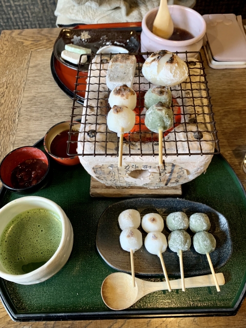 Visitors roasting dango at eXcafe Kyoto Arashiyama