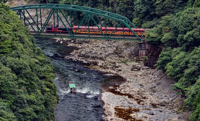 Sagano Romantic Train running above Hozu Gorge in Kyoto