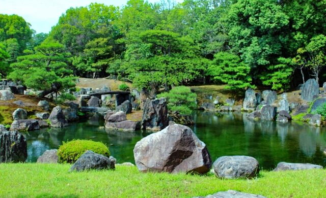 Pond, carefully arranged rocks, and pine trees in Ninomaru Garden at Nijo Castle in Kyoto