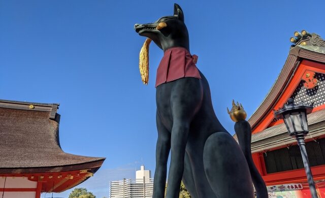 Fox guardian statue in front of the Main Hall at Fushimi Inari Taisha